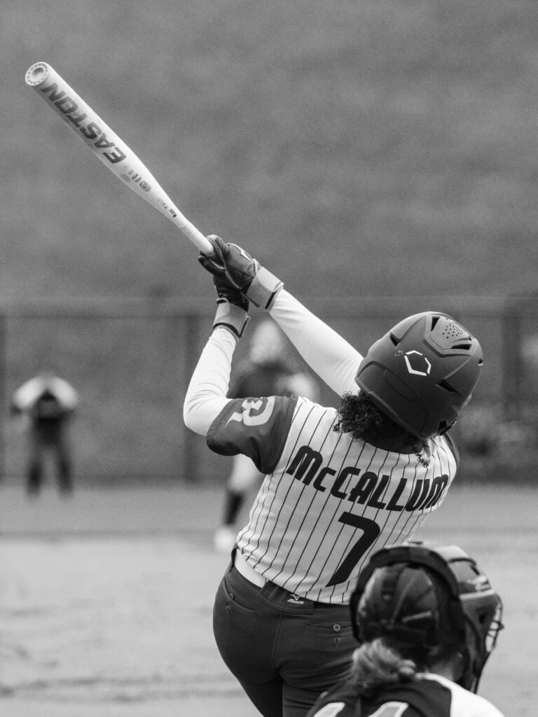 Black and white softball player at bat by Loudoun Sports Photography